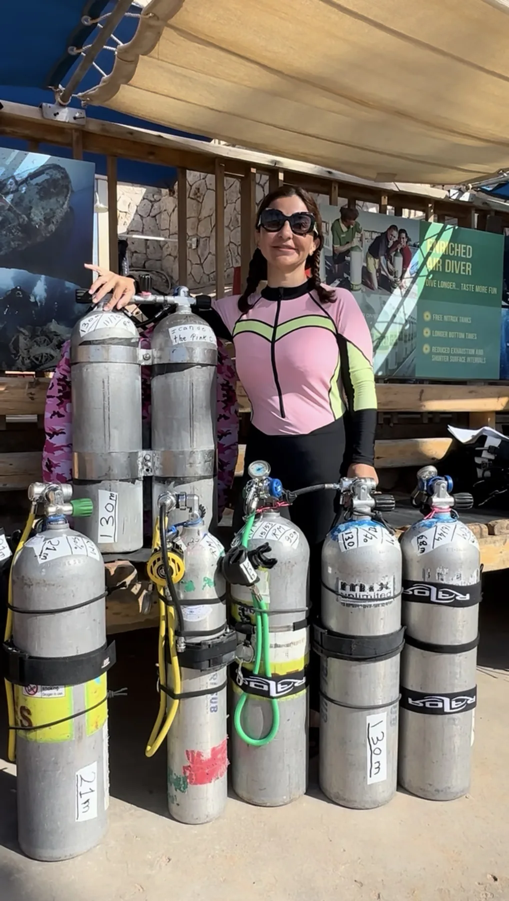 Rania Merched with technical diving cylinders